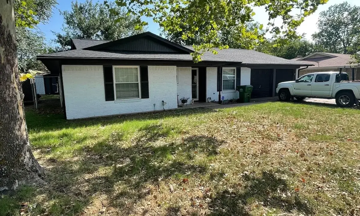 Professional roofing crew working on a residential roof in Pocahontas